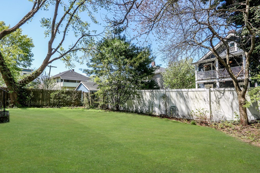 109 Adena Road, Unit 109 Newton, MA 02465 - Photo 22 of 23 a view of a house with a yard
