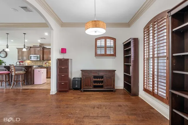 a living room with fireplace furniture and a window