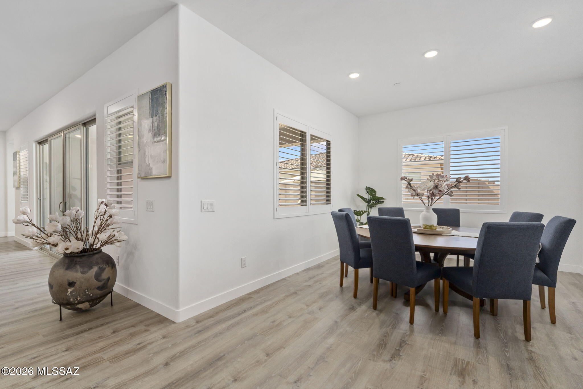 12791 East Tortoise Pointe Drive Vail, AZ 85641 - Photo 18 of 50 a view of a dining room with furniture window and wooden floor