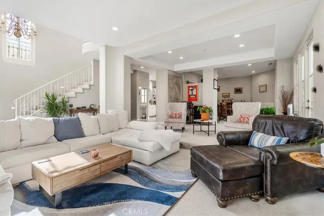 a living room with furniture or couch and a potted plant