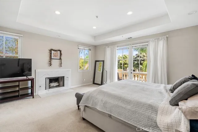 a bedroom with a bed and a television