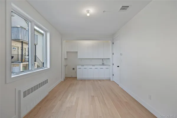 a view of balcony with wooden floor