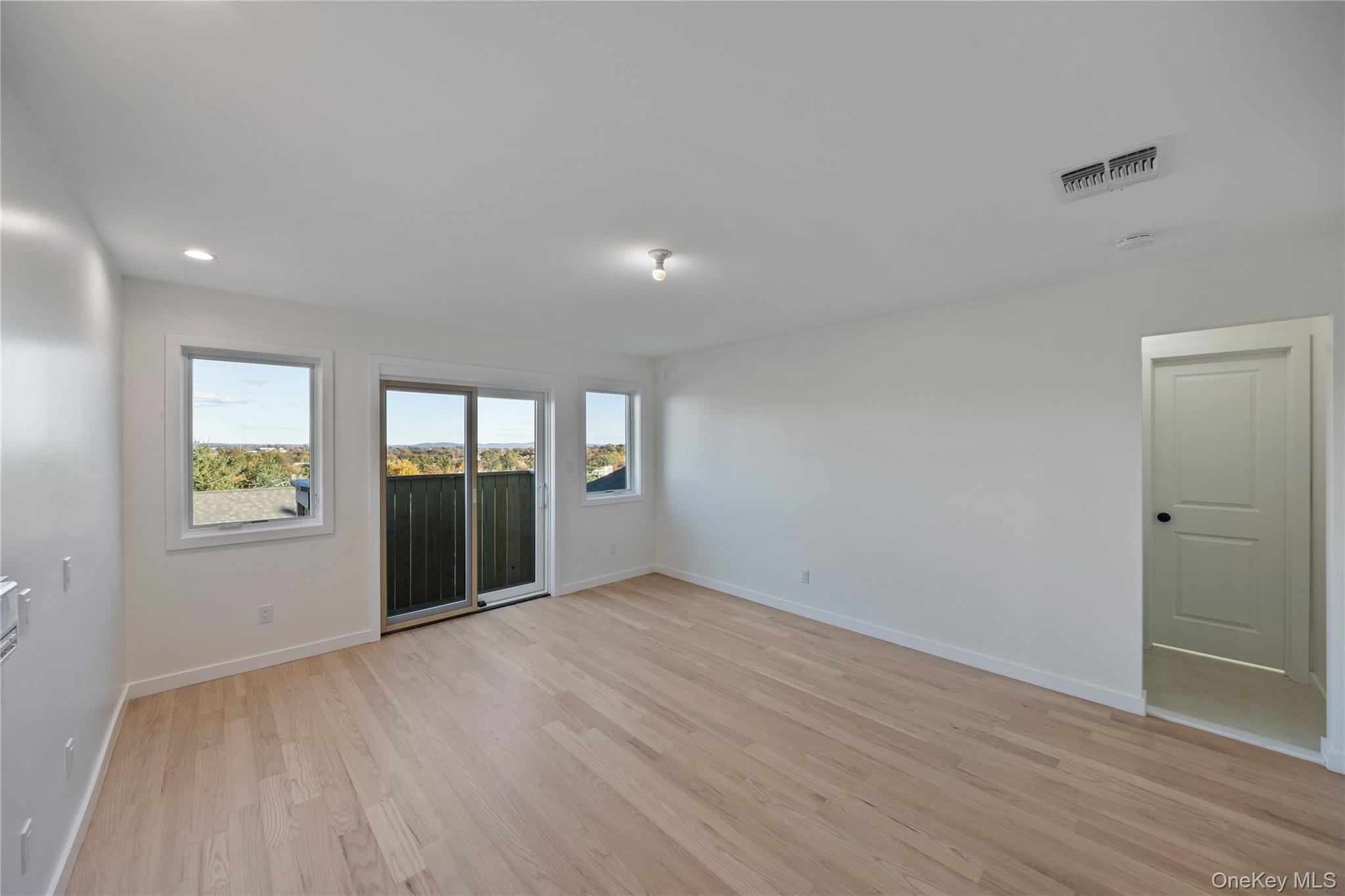 352 Blauvelt Road, Unit 203 Monsey, NY 10952 - Photo 16 of 33 wooden floor in an empty room with a window