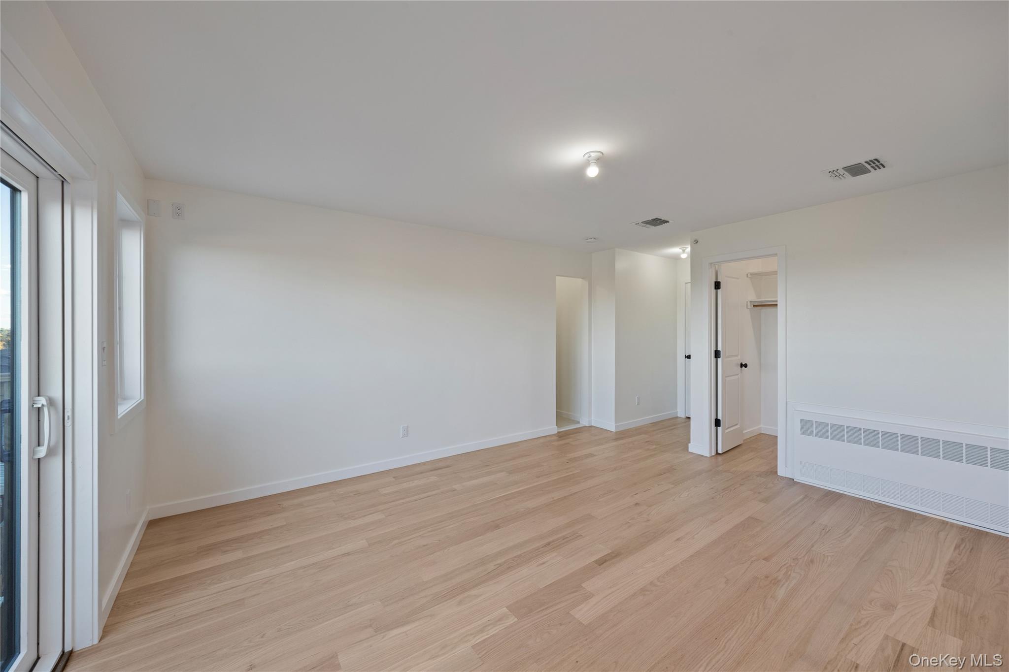 352 Blauvelt Road, Unit 203 Monsey, NY 10952 - Photo 18 of 33 a view of an empty room with wooden floor