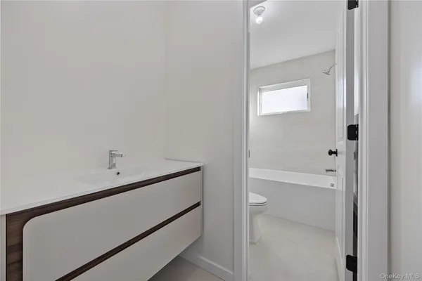 a bathroom with a toilet and a bathtub