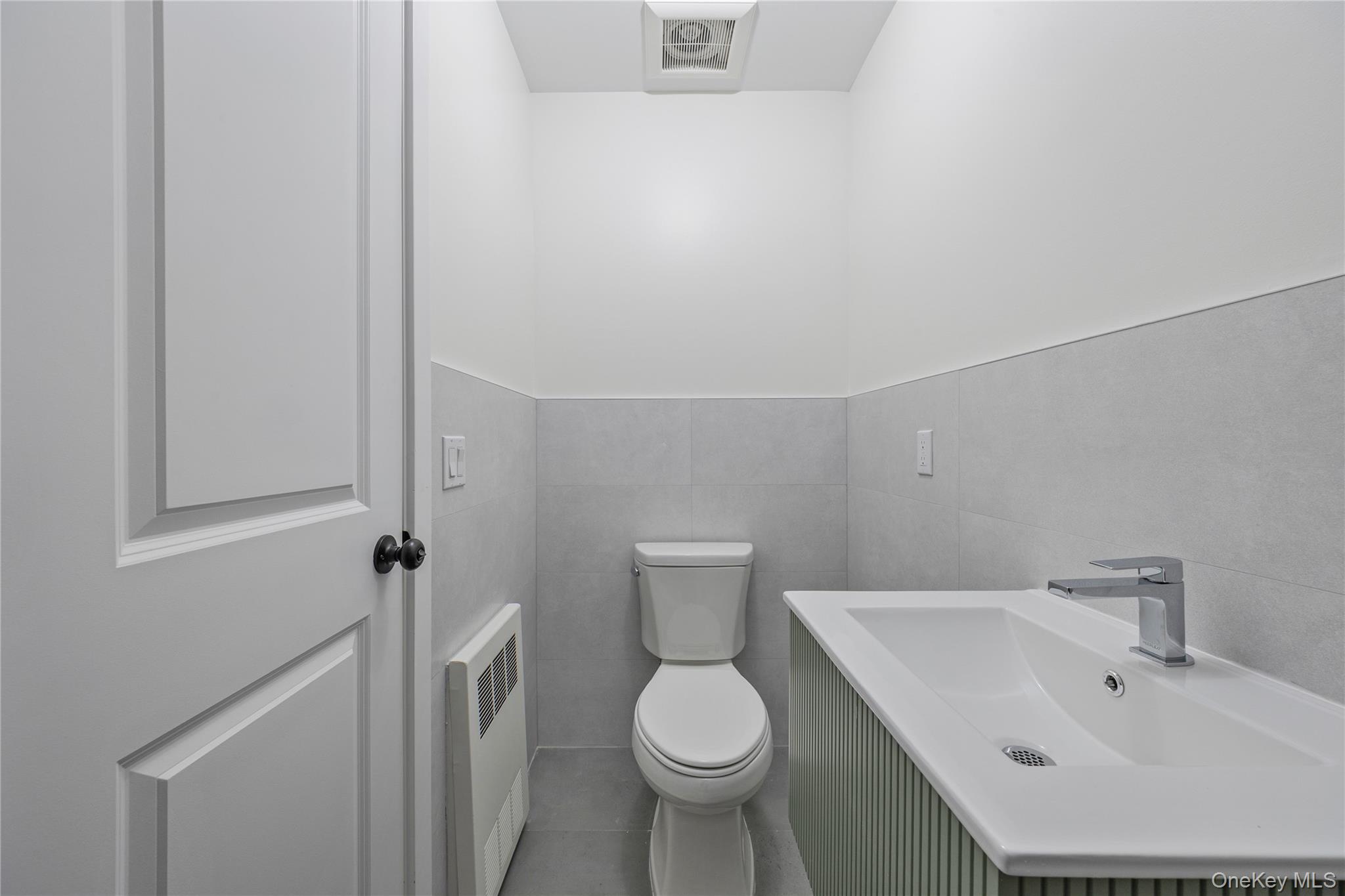 352 Blauvelt Road, Unit 203 Monsey, NY 10952 - Photo 29 of 33 a white toilet sitting next to a bathroom sink