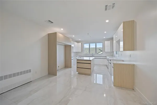 a kitchen with a sink stainless steel appliances and cabinets
