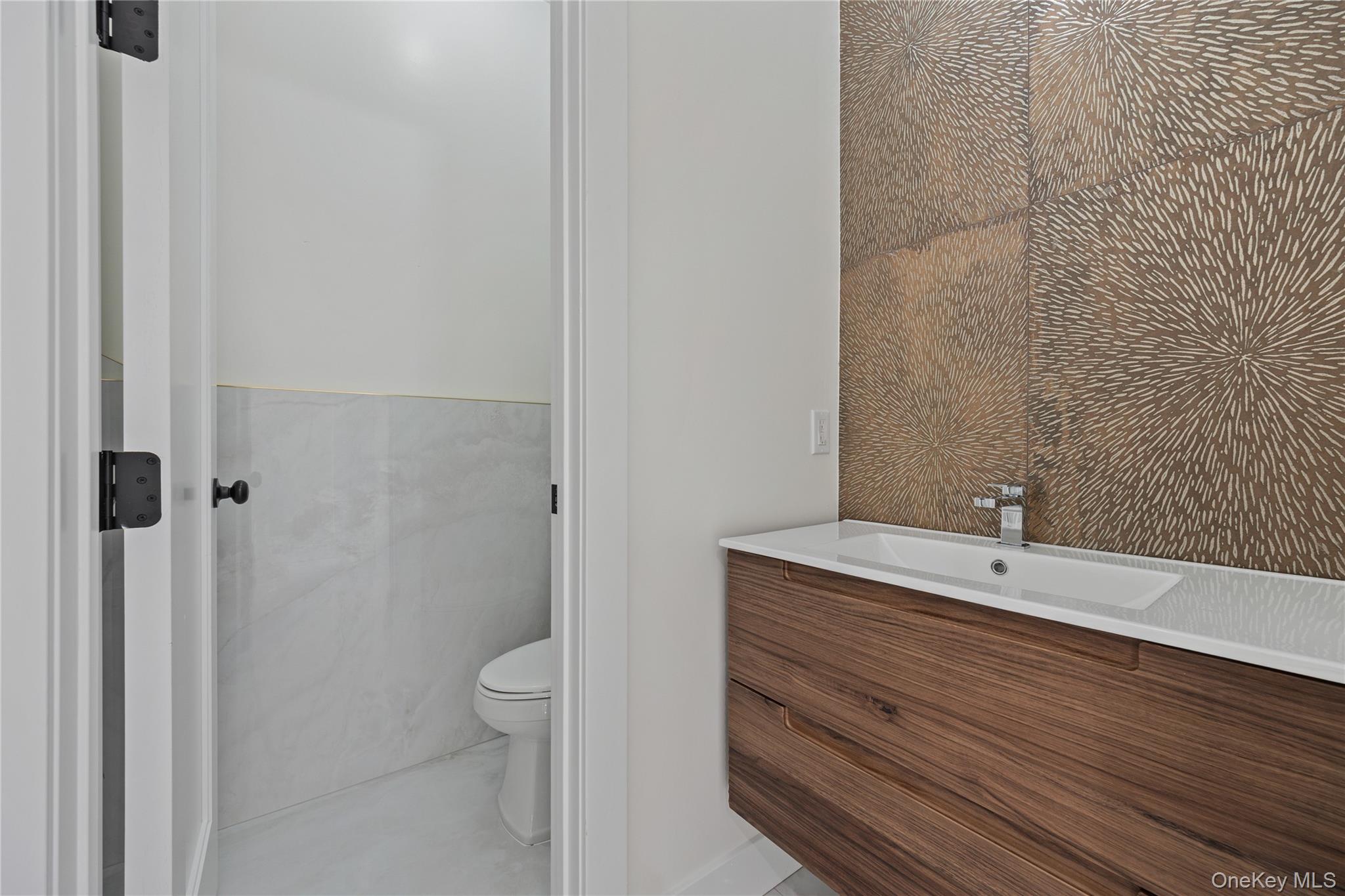 352 Blauvelt Road, Unit 203 Monsey, NY 10952 - Photo 9 of 33 a bathroom with a sink a toilet and shower