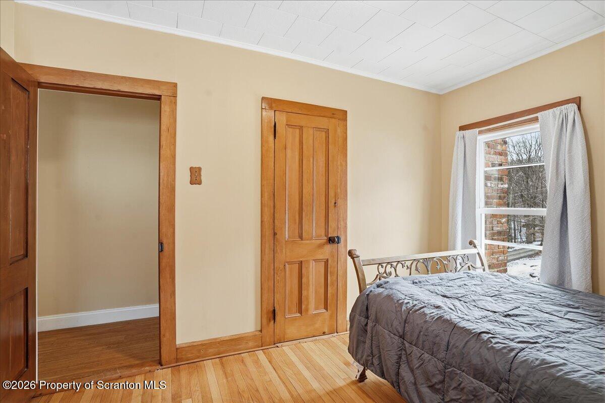 795 Wescott Road New Milford, PA 18834 - Photo 50 of 81 a bedroom with a bed and a window
