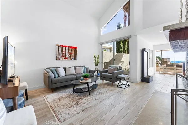 a living room with furniture or couch and a flat screen tv