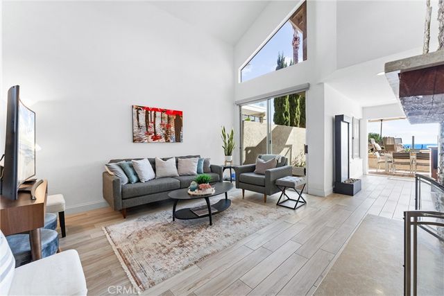 a living room with furniture or couch and a flat screen tv