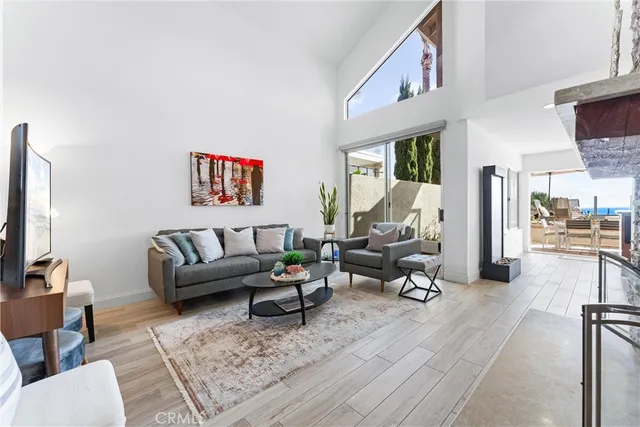 a living room with furniture or couch and a flat screen tv