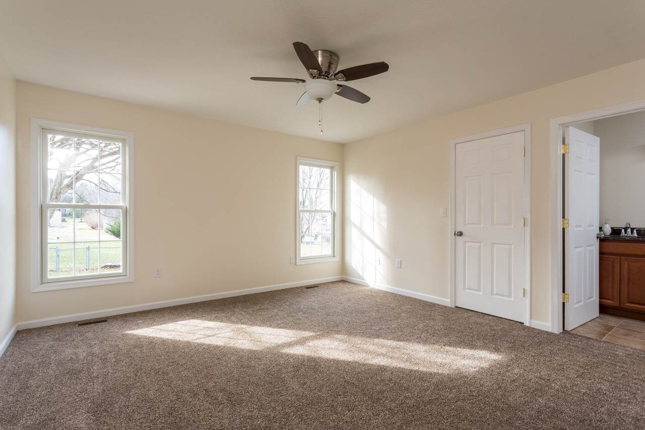 227 Harriston Road Grottoes, VA 24441 - Photo 10 of 25 an empty room with windows and ceiling fan