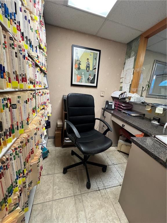 207 Ocean Parkway, Unit 1J Brooklyn, NY 11218 - Photo 7 of 11 a living room with lots of furniture and a painting on the wall