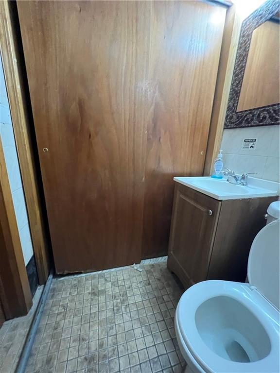 207 Ocean Parkway, Unit 1J Brooklyn, NY 11218 - Photo 8 of 11 a bathroom with a toilet and a sink