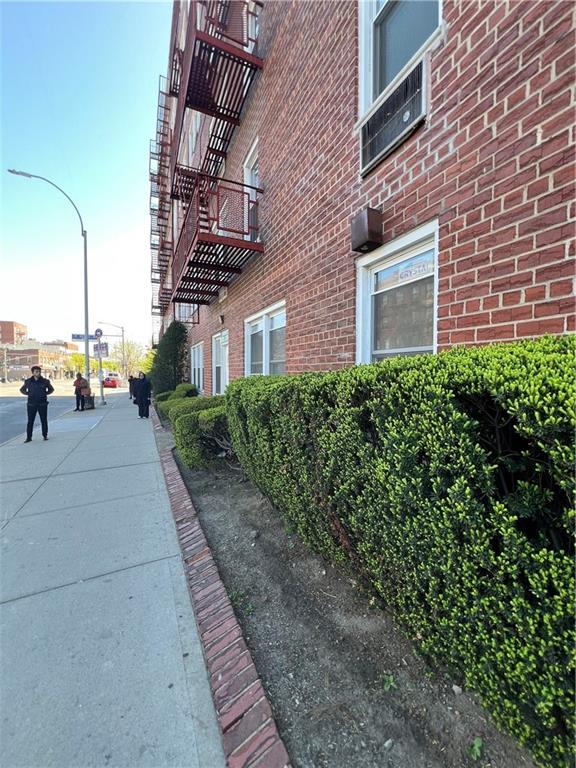 207 Ocean Parkway, Unit 1J Brooklyn, NY 11218 - Photo 10 of 11 a pathway of a brick house with a yard