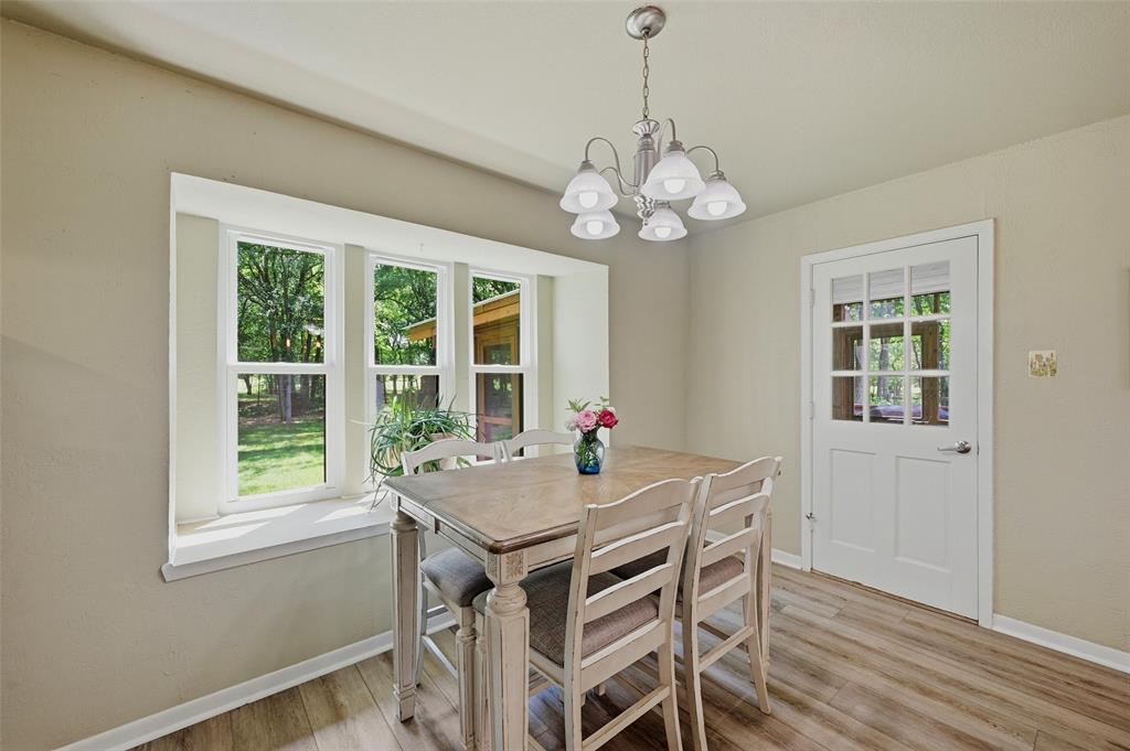 522 High Country Road Sherman, TX 75092 - Photo 13 of 38 a view of a dining room with a table and chairs
