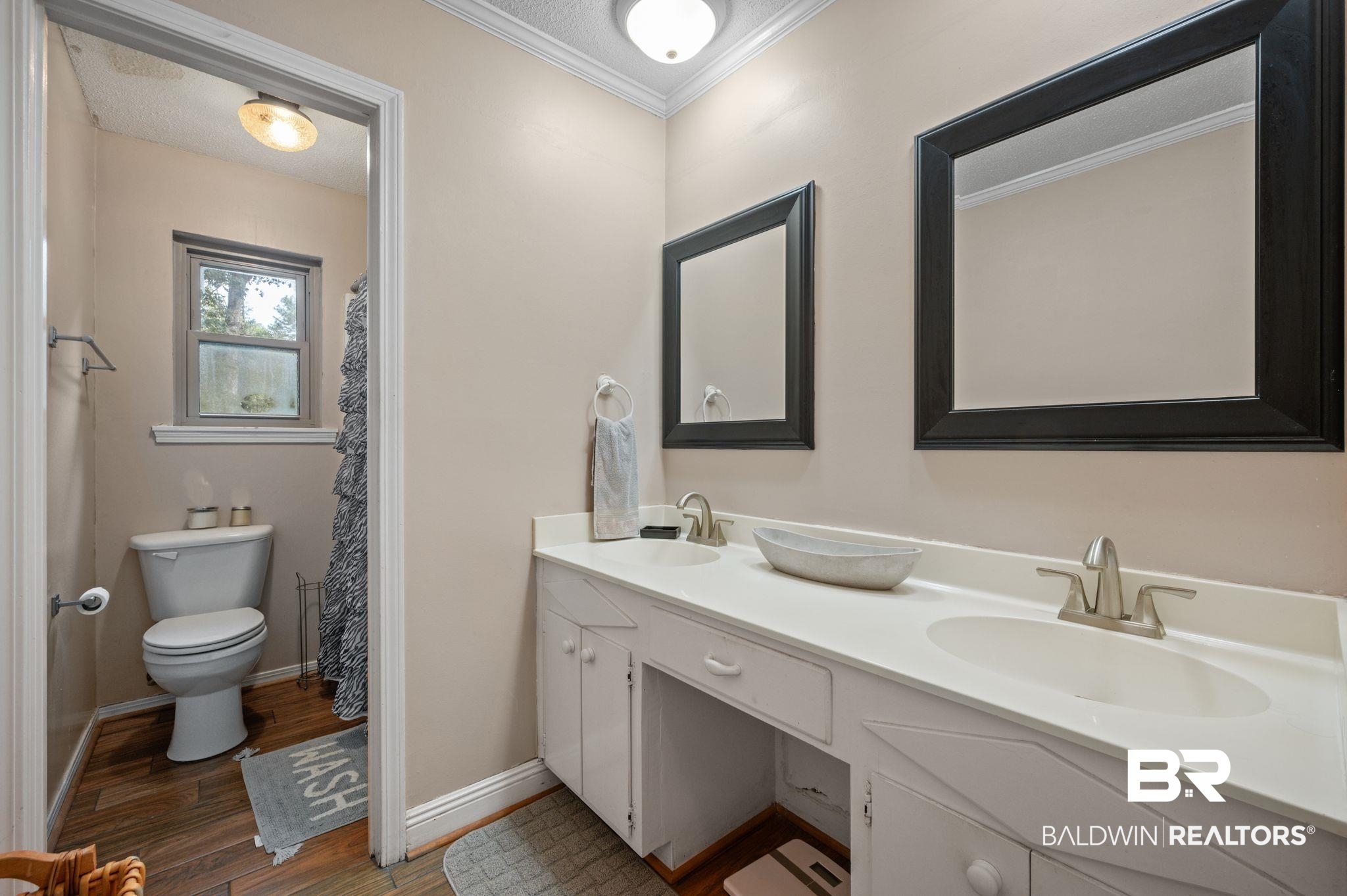 4566 McCrary Road, Unit A Semmes, AL 36575 - Photo 20 of 28 Bathroom featuring hardwood / wood-style floors, toilet, crown molding, and vanity