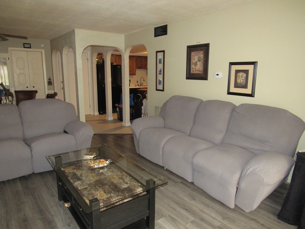 2 Shadowbrook Lane, Unit 50 Milford, MA 01757 - Photo 11 of 26 a living room with furniture and a couch