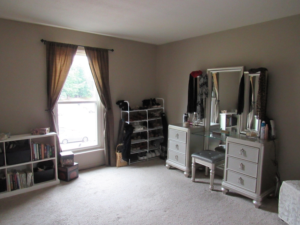 2 Shadowbrook Lane, Unit 50 Milford, MA 01757 - Photo 20 of 26 a view of a room with window and furniture