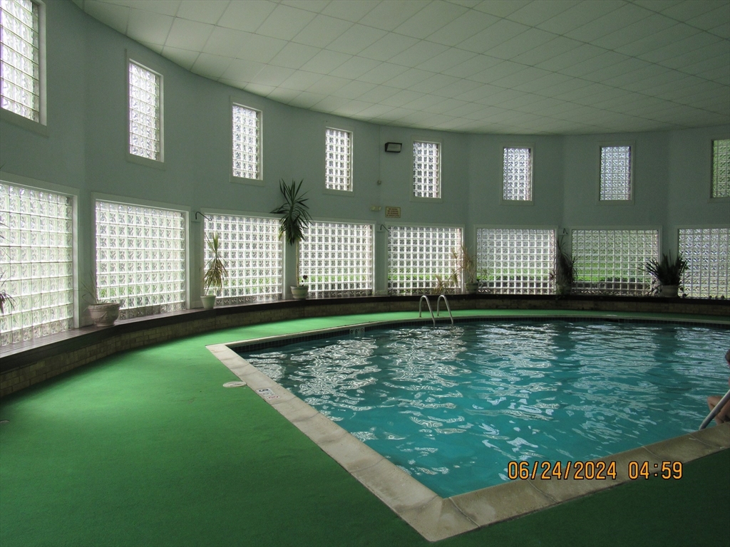 2 Shadowbrook Lane, Unit 50 Milford, MA 01757 - Photo 25 of 26 a view of a living room and a window
