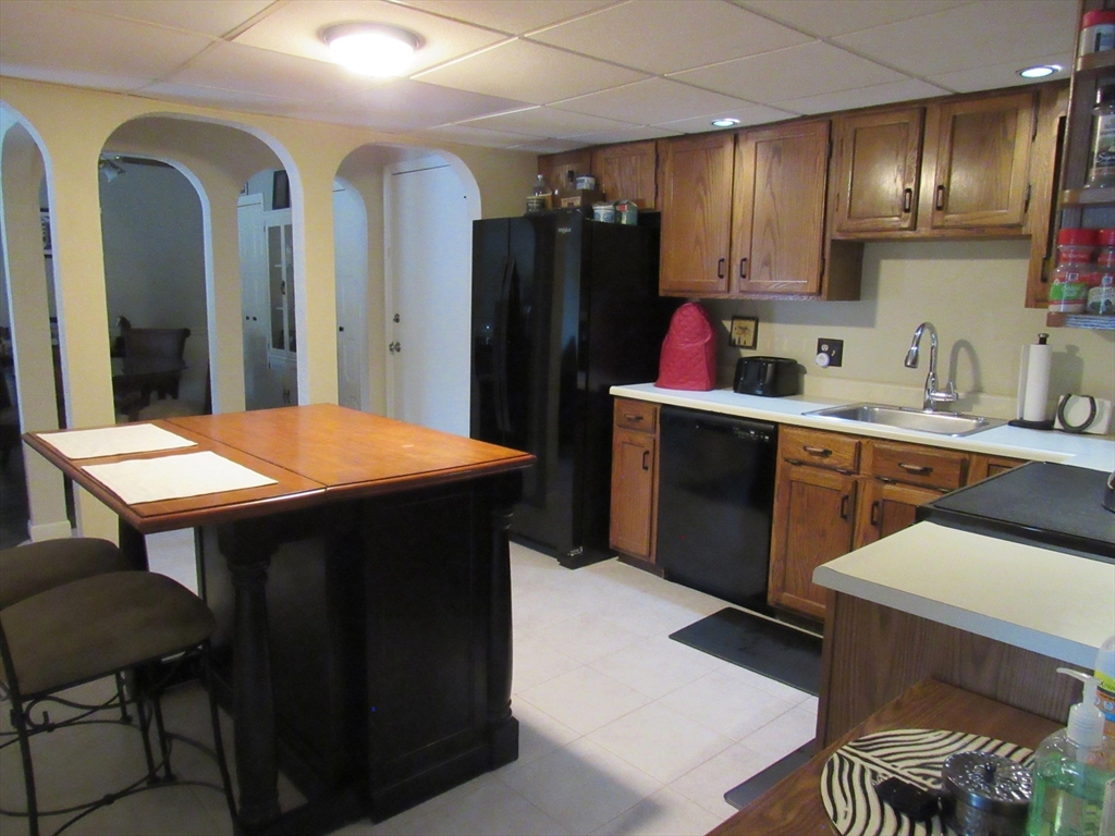 2 Shadowbrook Lane, Unit 50 Milford, MA 01757 - Photo 5 of 26 a kitchen with a sink cabinets and wooden floor