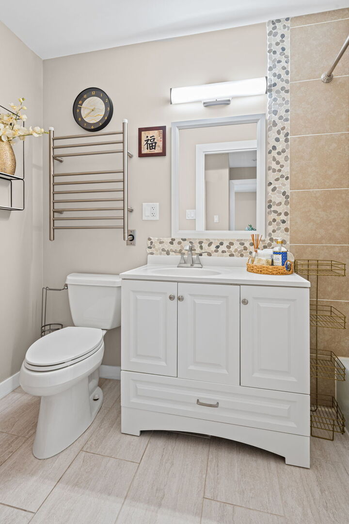 1205 East Hintz Road, Unit 209 Arlington Heights, IL 60004 - Photo 14 of 27 a bathroom with a toilet sink and mirror