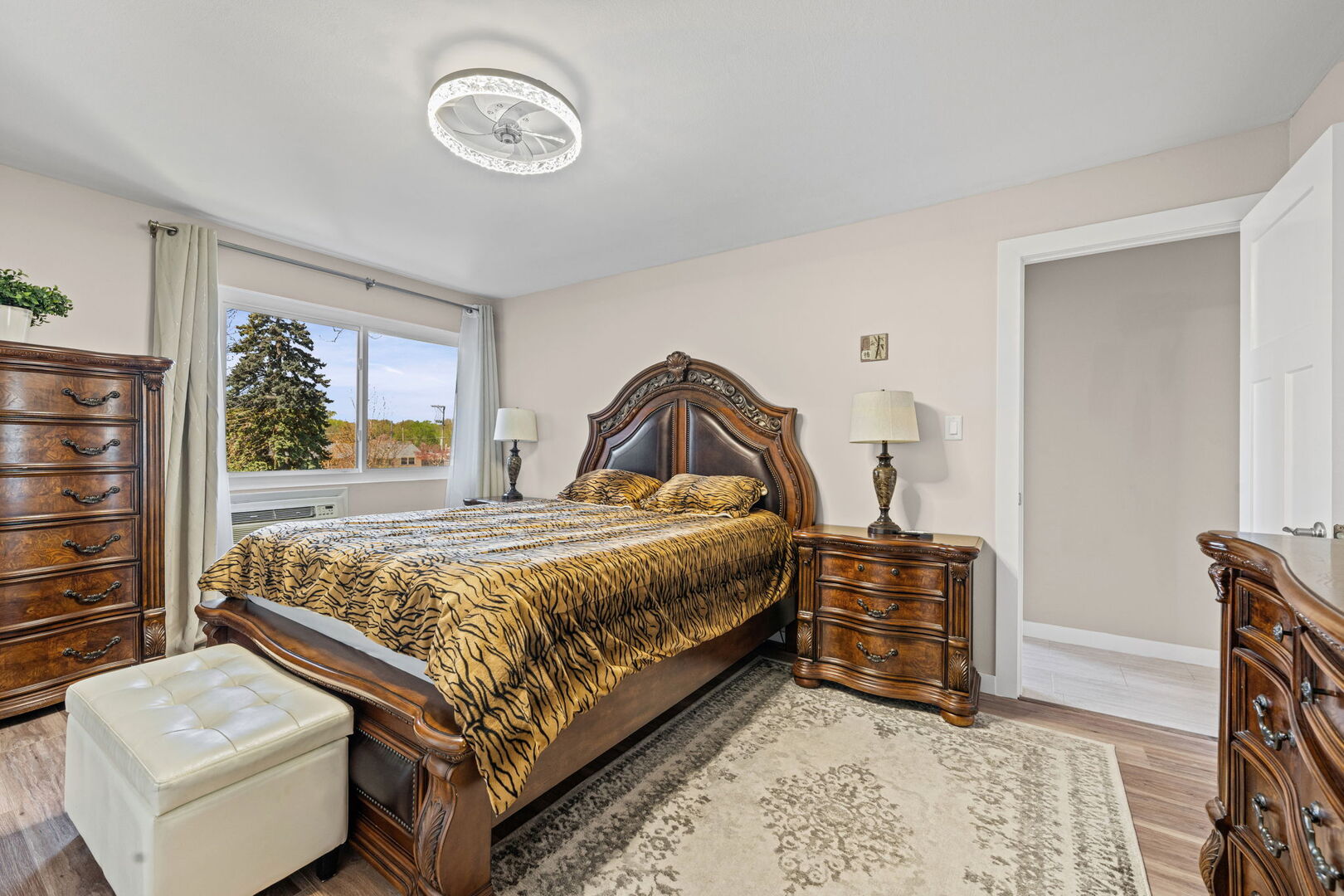 1205 East Hintz Road, Unit 209 Arlington Heights, IL 60004 - Photo 20 of 27 a bedroom with a bed and a window