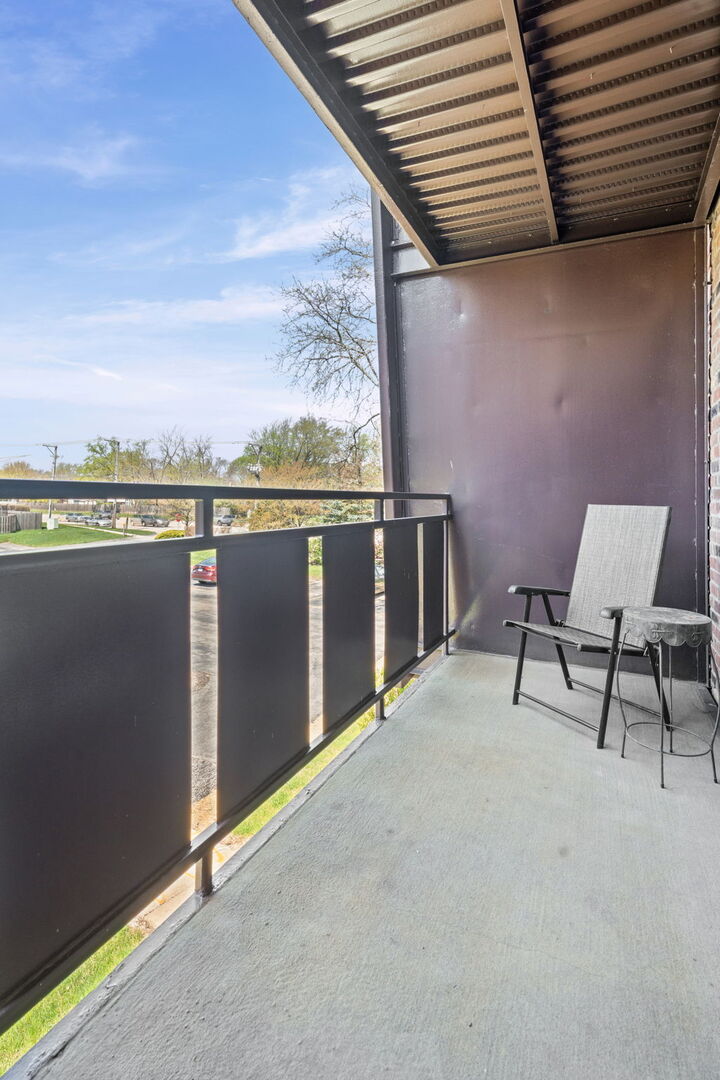 1205 East Hintz Road, Unit 209 Arlington Heights, IL 60004 - Photo 21 of 27 a view of balcony with furniture