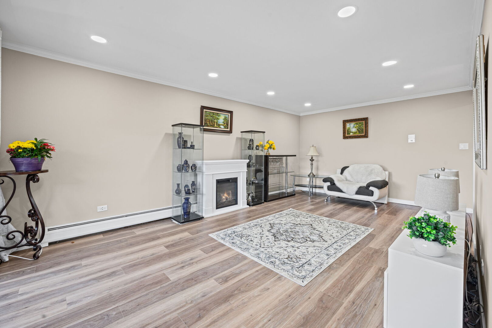 1205 East Hintz Road, Unit 209 Arlington Heights, IL 60004 - Photo 3 of 27 a view of a livingroom with furniture and a ceiling fan