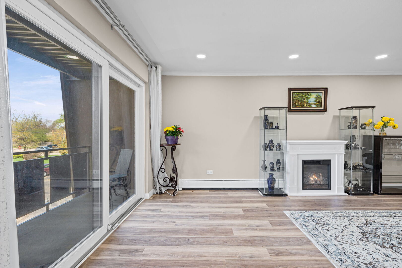 1205 East Hintz Road, Unit 209 Arlington Heights, IL 60004 - Photo 4 of 27 a view of a livingroom with a fireplace