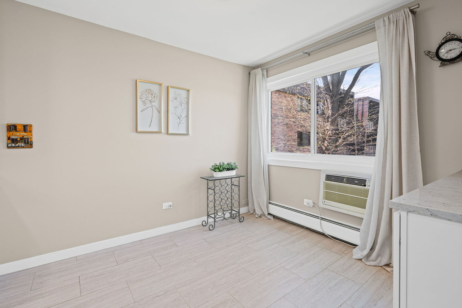 1205 East Hintz Road, Unit 209 Arlington Heights, IL 60004 - Photo 7 of 27 a view of an empty room with a window