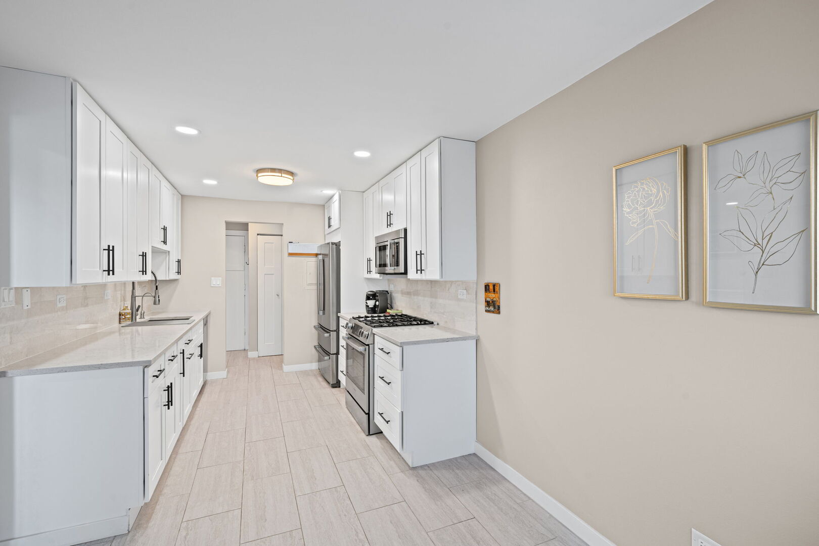 1205 East Hintz Road, Unit 209 Arlington Heights, IL 60004 - Photo 10 of 27 a kitchen with a sink stove and refrigerator