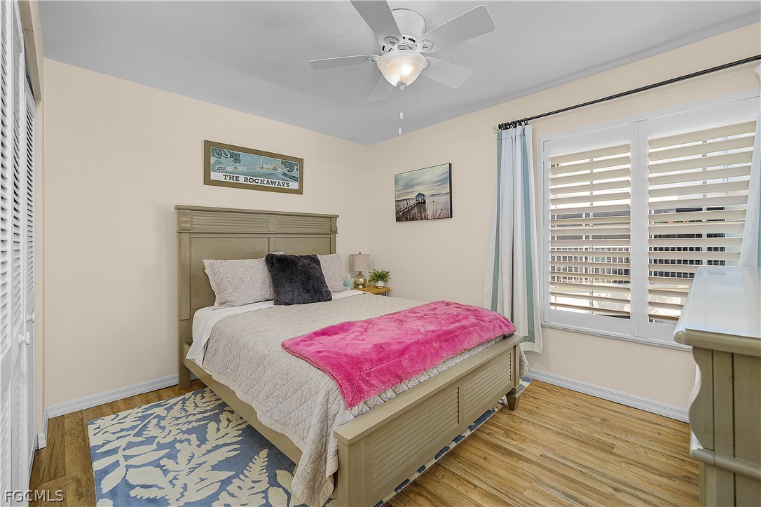 14983 Rivers Edge Court, Unit 232 Fort Myers, FL 33908 - Photo 20 of 27 a bedroom with a bed and a window