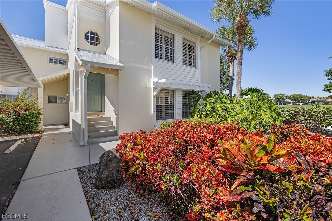 14983 Rivers Edge Court, Unit 232 Fort Myers, FL 33908 - Photo 24 of 27 a front view of a house with garden