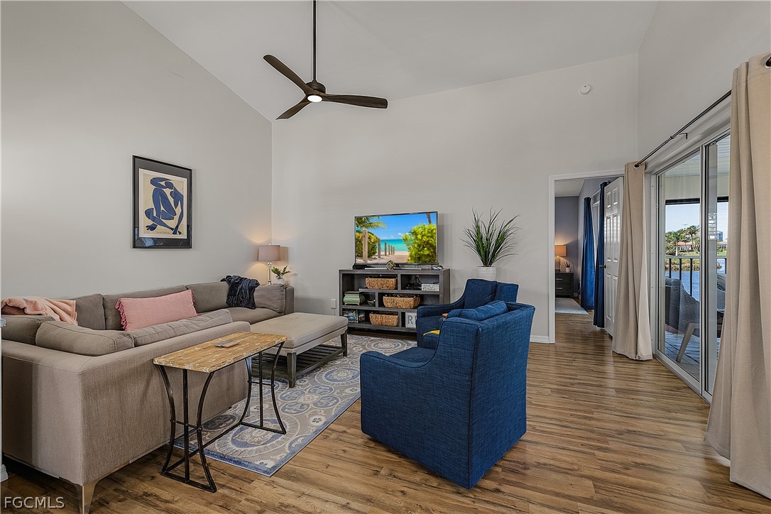 14983 Rivers Edge Court, Unit 232 Fort Myers, FL 33908 - Photo 4 of 27 a living room with furniture and a flat screen tv