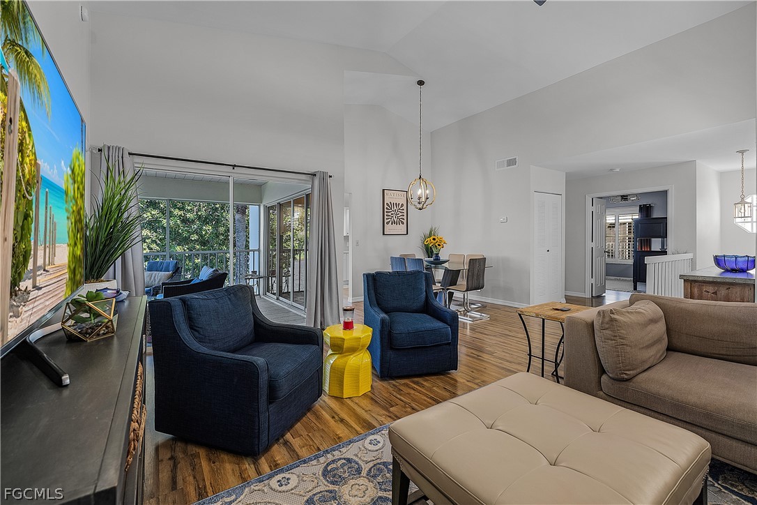14983 Rivers Edge Court, Unit 232 Fort Myers, FL 33908 - Photo 5 of 27 a living room with furniture and a large window