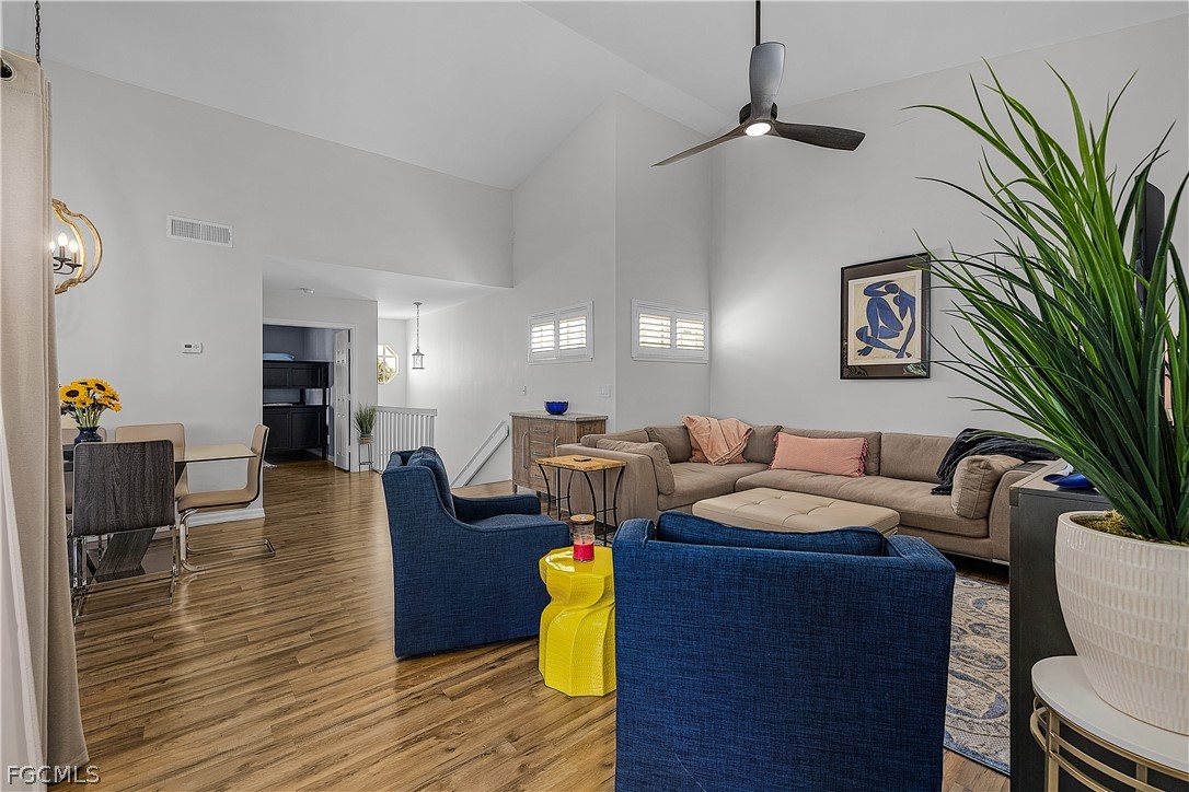 14983 Rivers Edge Court, Unit 232 Fort Myers, FL 33908 - Photo 6 of 27 a living room with furniture and wooden floor