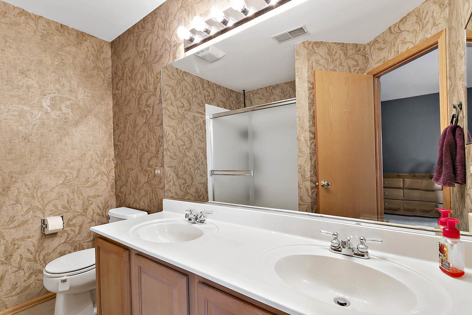 3459 Ravinia Circle, Unit 3459 Aurora, IL 60504 - Photo 15 of 18 a bathroom with a sink toilet and shower