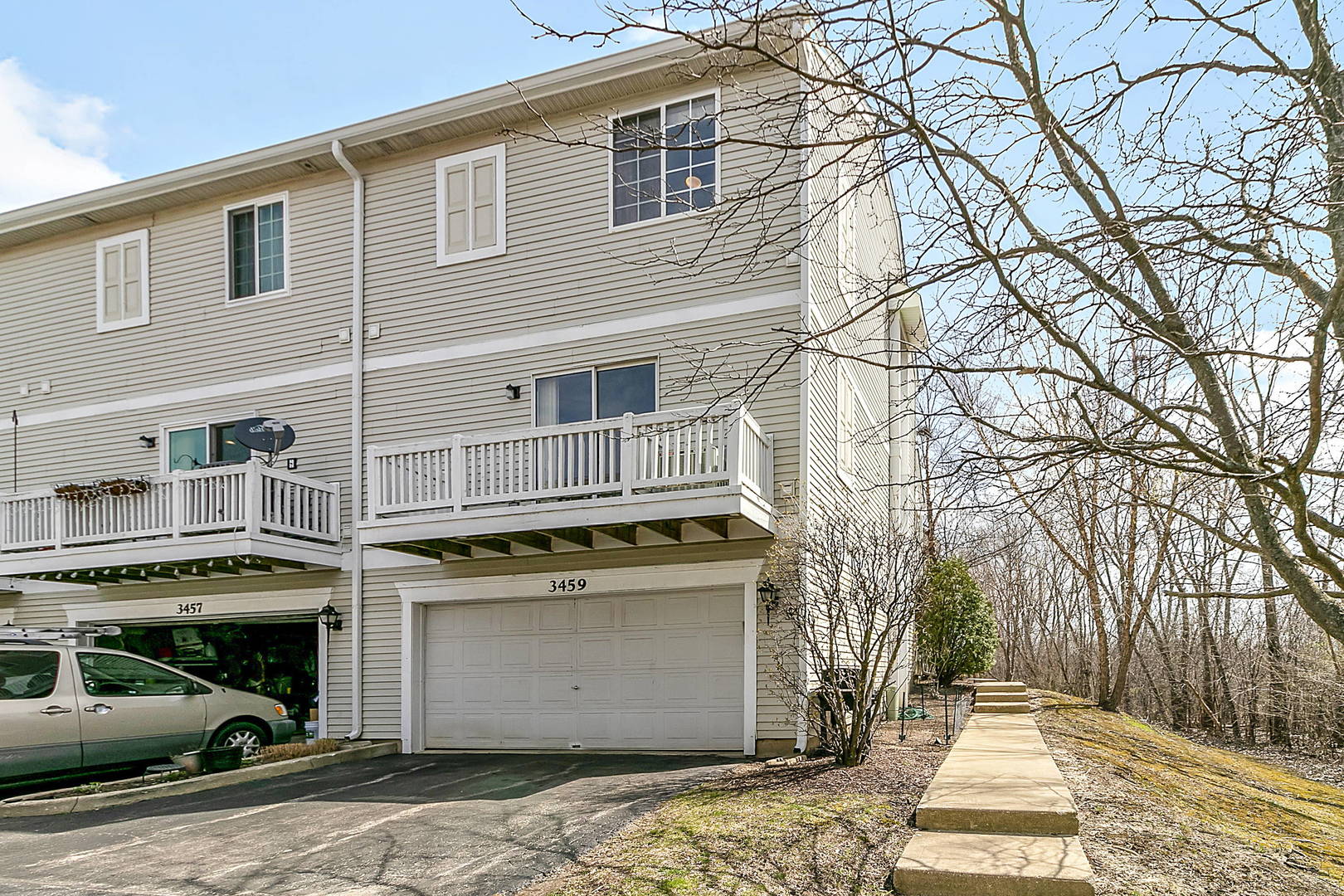 3459 Ravinia Circle, Unit 3459 Aurora, IL 60504 - Photo 2 of 18 a front view of a house with a yard
