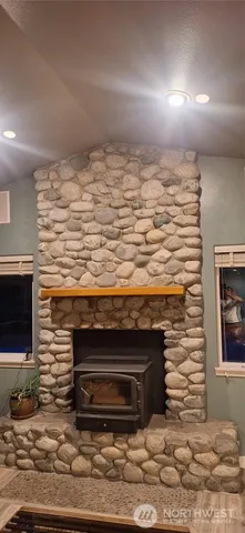 a view of stove top oven and kitchen area
