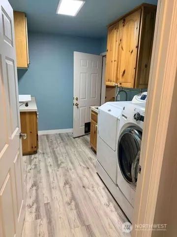 a utility room with a window dryer and washer