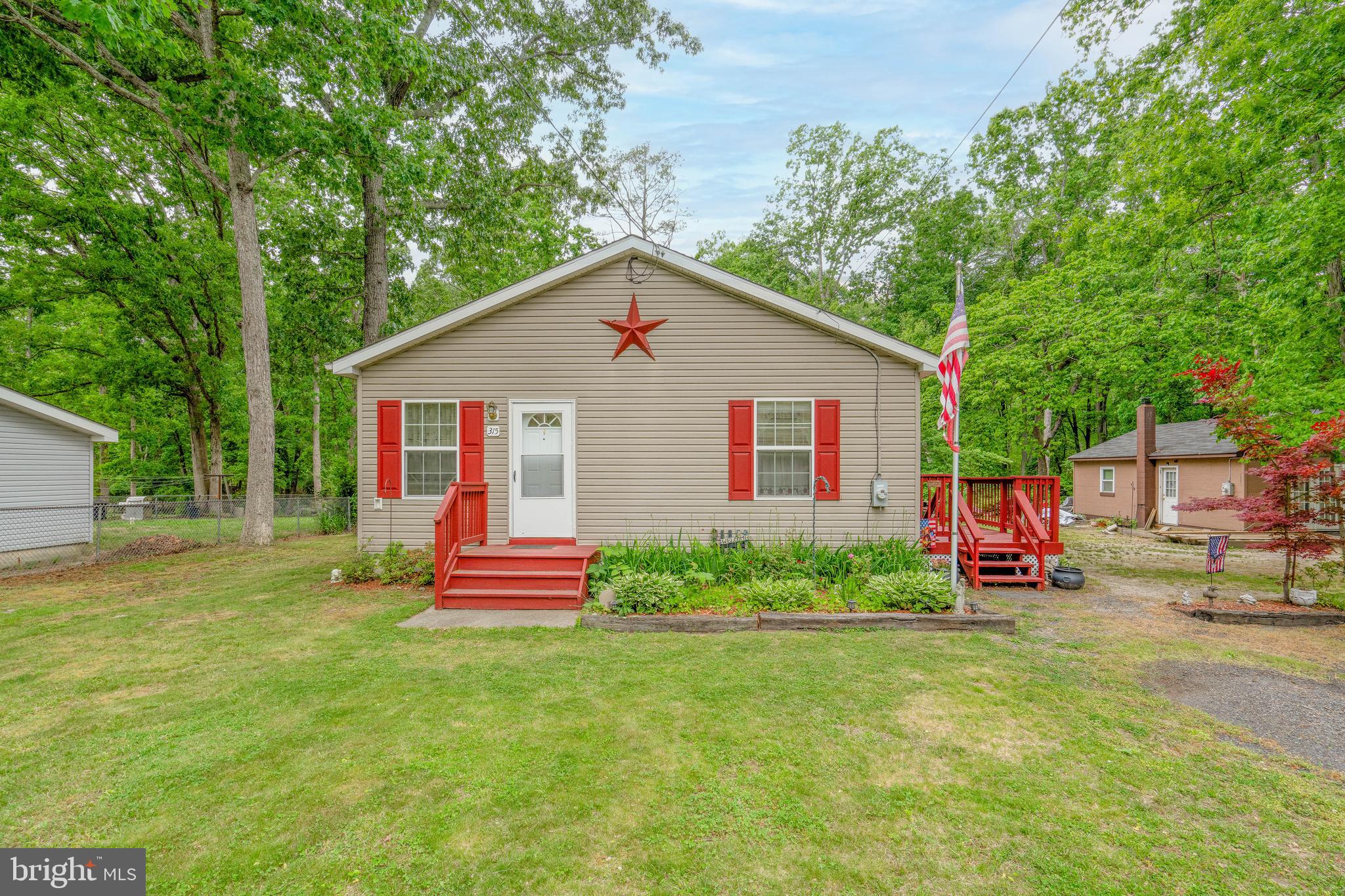 315 Beech Road Millville, NJ 08332 - Photo 1 of 21 a front view of a house with a yard