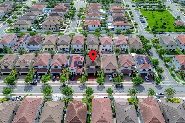 an aerial view of a houses and lake view