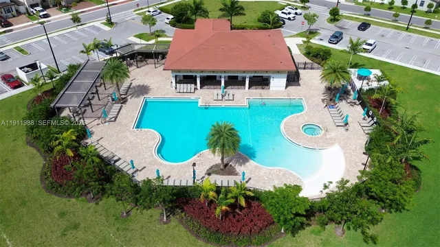 an aerial view of a house with garden space and street view
