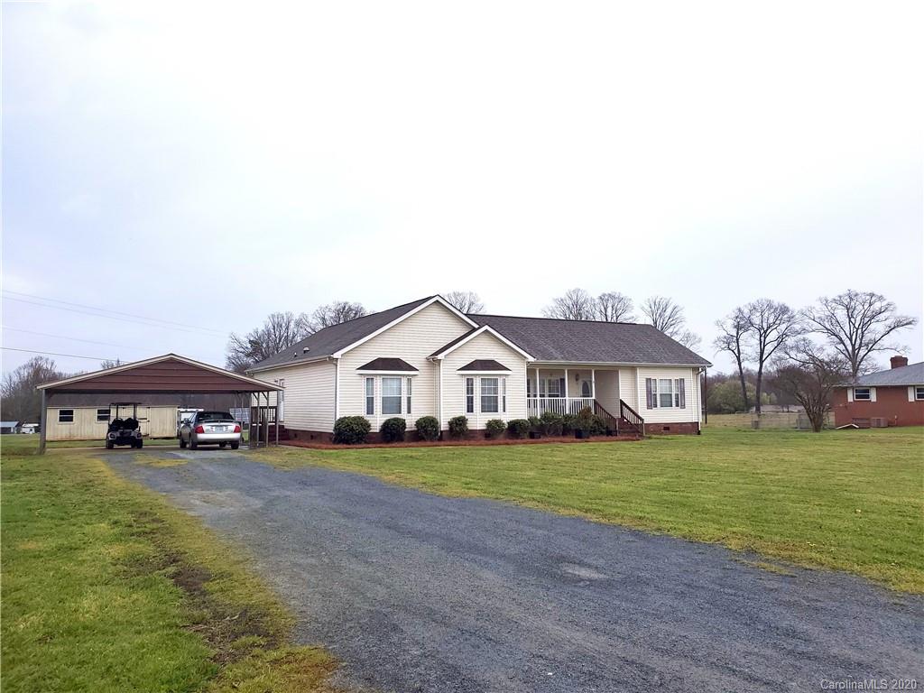 340 Weaver Road Salisbury, NC 28147 - Photo 1 of 23 a view of a house with a big yard and large trees