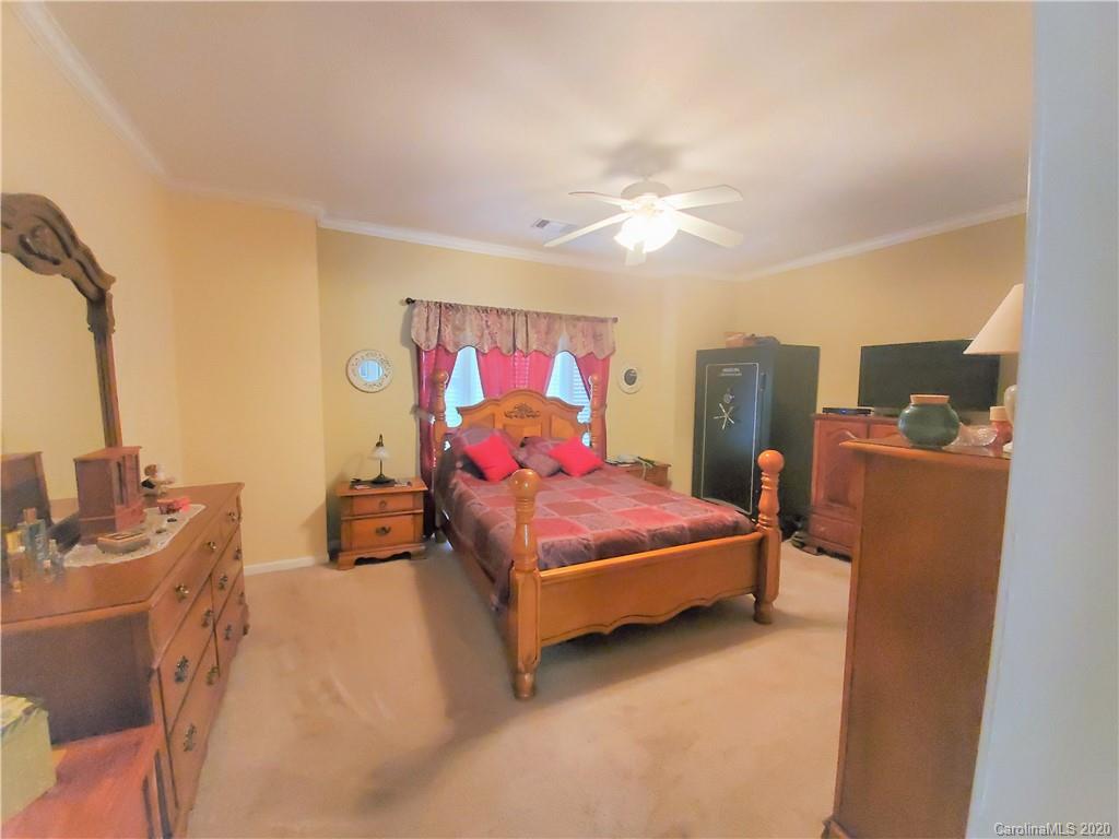 340 Weaver Road Salisbury, NC 28147 - Photo 12 of 23 a bedroom with furniture and flat screen tv