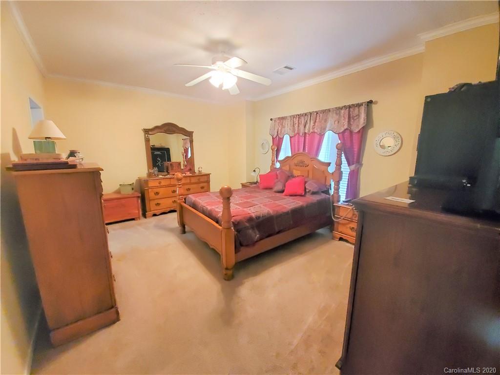 340 Weaver Road Salisbury, NC 28147 - Photo 13 of 23 a bedroom with furniture and a flat screen tv