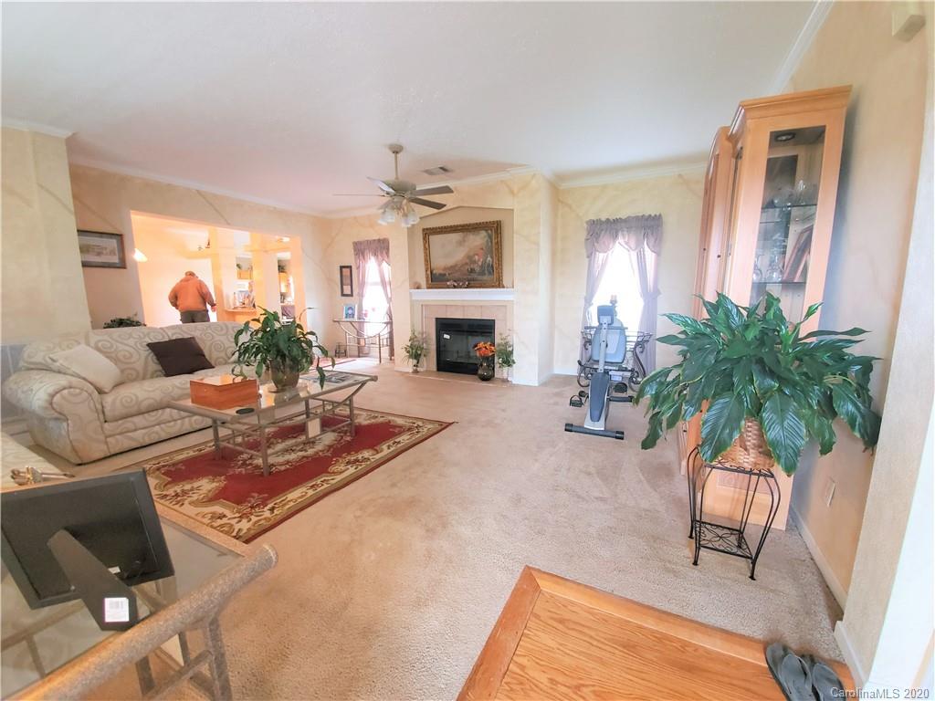 340 Weaver Road Salisbury, NC 28147 - Photo 14 of 23 a living room with furniture fireplace and potted plants