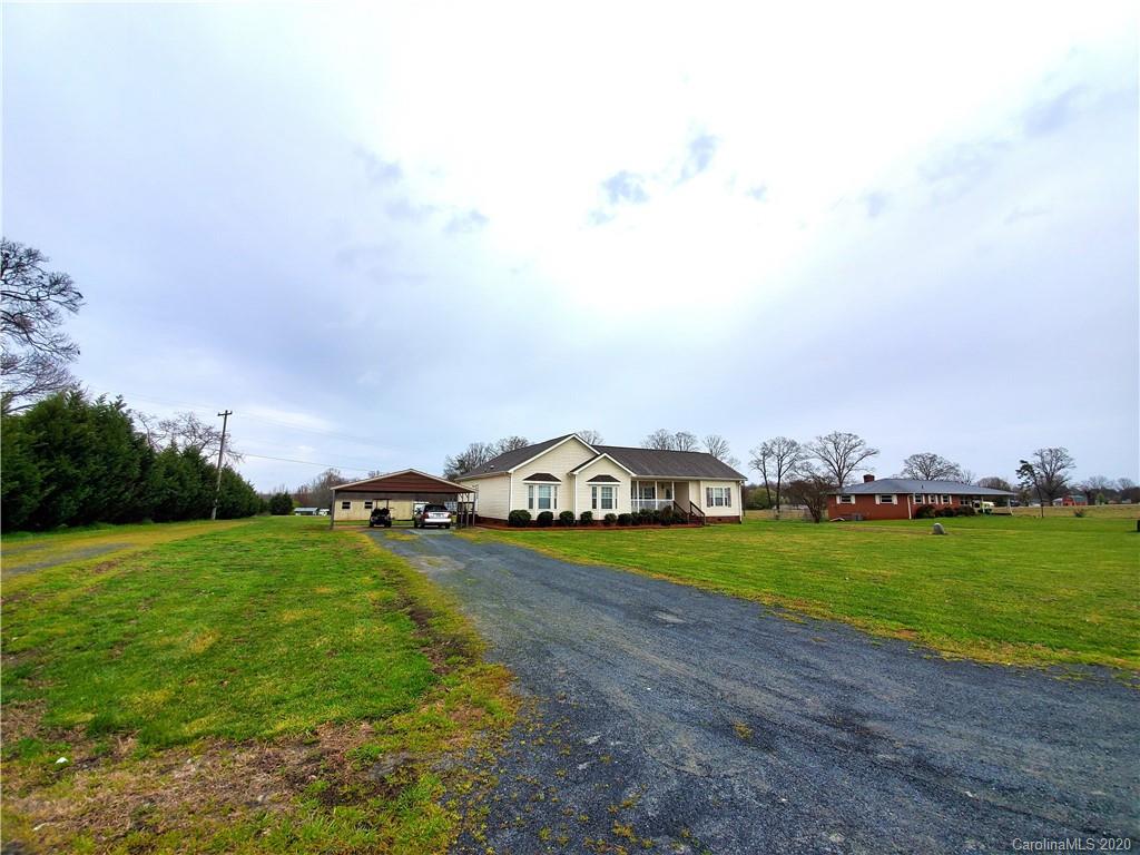340 Weaver Road Salisbury, NC 28147 - Photo 5 of 23 a view of a big yard with potted plants and mountain view